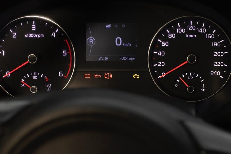 Car dashboard with speedometer, tachometer, and various warning lights. Digital screen shows 0 km/h, odometer reads 70045 km, and outside temperature is 3°C. It's crucial to address any transmission problems to avoid unexpected repairs or breakdowns while driving.